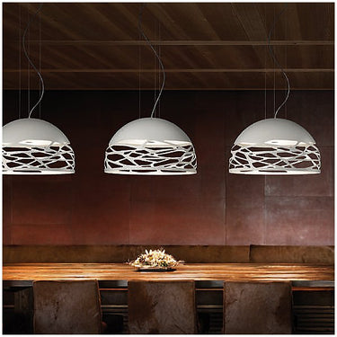 Contemporary coppery bronze Kelly Dome Pendant by Lodes over dining table