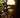 Mini Art Deco Cordless Lamp Antique Brass illuminating a room
