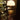 Mini Art Deco Cordless Lamp Antique Brass illuminating a room