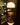 Mini Art Deco Cordless Lamp Antique Brass illuminating a room