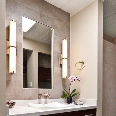 Metro vanity light in a calm, modern bathroom
