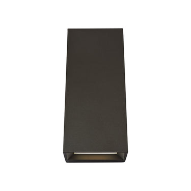 Pitch 12 modern exterior wall light installed on residential stucco wall, black finish.