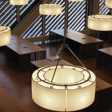 Large Sexta 12 pendant light suspended above modern dining table