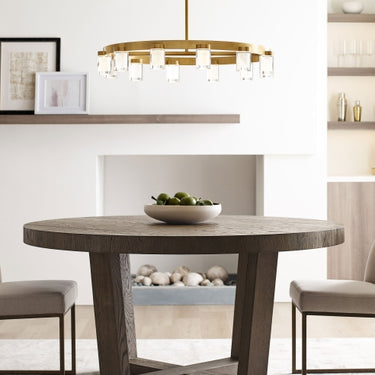 Dimmable LED circular chandelier with natural brass finish.