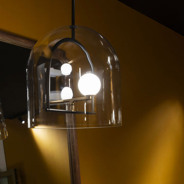 Luxury Italian Yanzi pendant light by Artemide with brushed brass swallows and opal glass diffuser