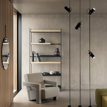Lodes Cima versatile LED lamp in a contemporary office setting, featuring a yellow rope and black counterweight.