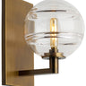 Modern LED Sedona wall light fixture with clear glass globe and antique brass finish for upscale interiors