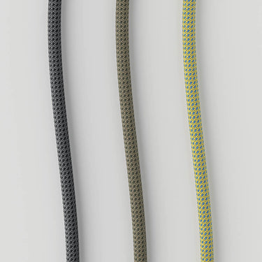 Close-up of cord colors available of the Lodes Cima's black metal lamp head on a gold rope, showcasing adjustable mechanism.
